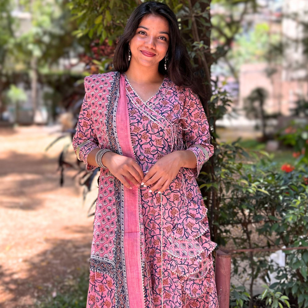 
                      
                        Floral Hand-Printed Pink Angarkha Suit Set in Pure Cotton with Gota Pati Details
                      
                    