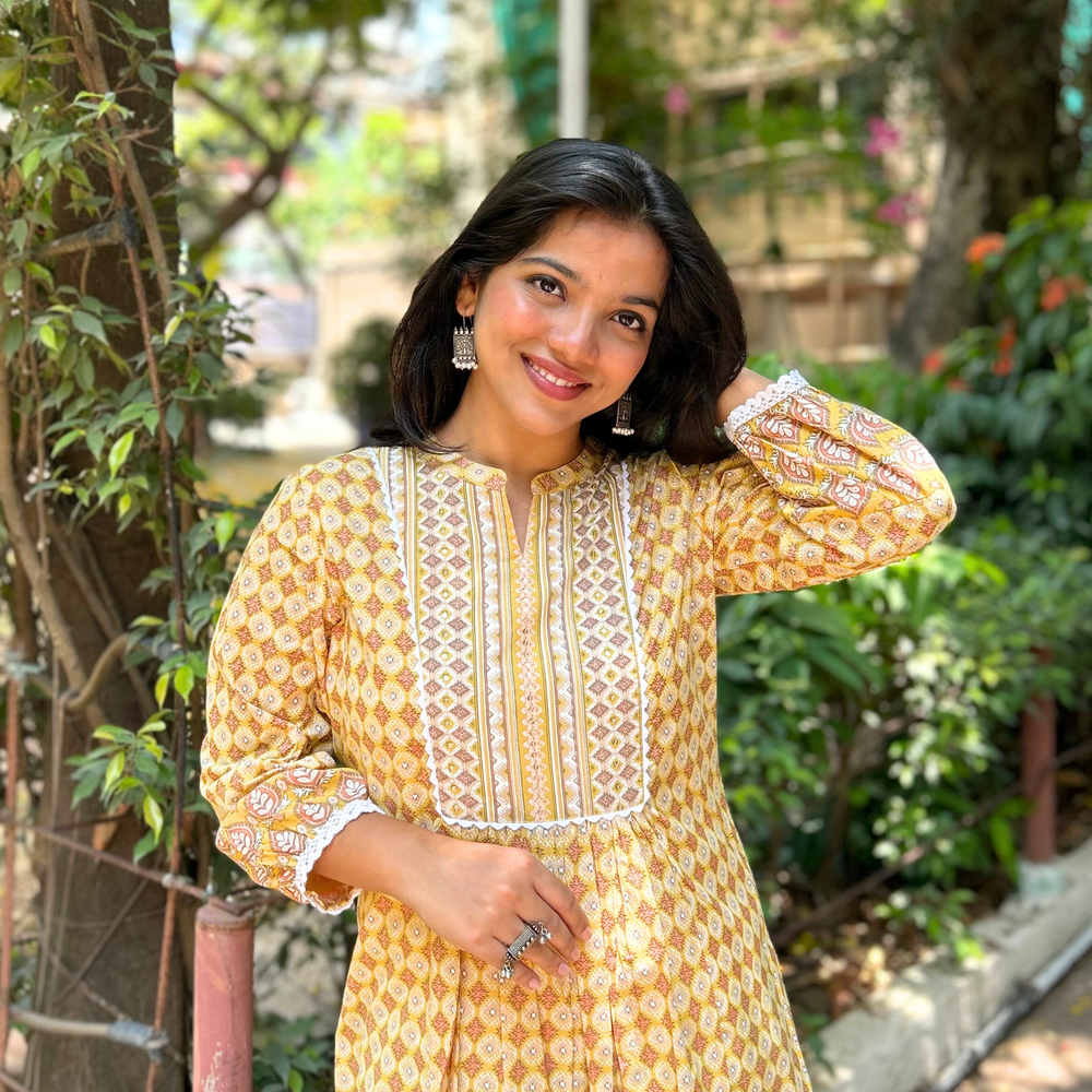 
                      
                        Yellow Geometric Hand-Printed Pure Cotton Kurti with Sequence Embroidery
                      
                    