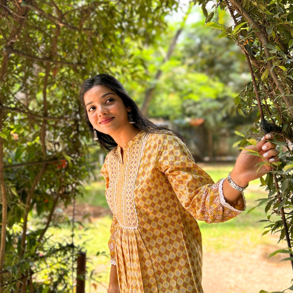 
                      
                        Yellow Geometric Hand-Printed Pure Cotton Kurti with Sequence Embroidery
                      
                    